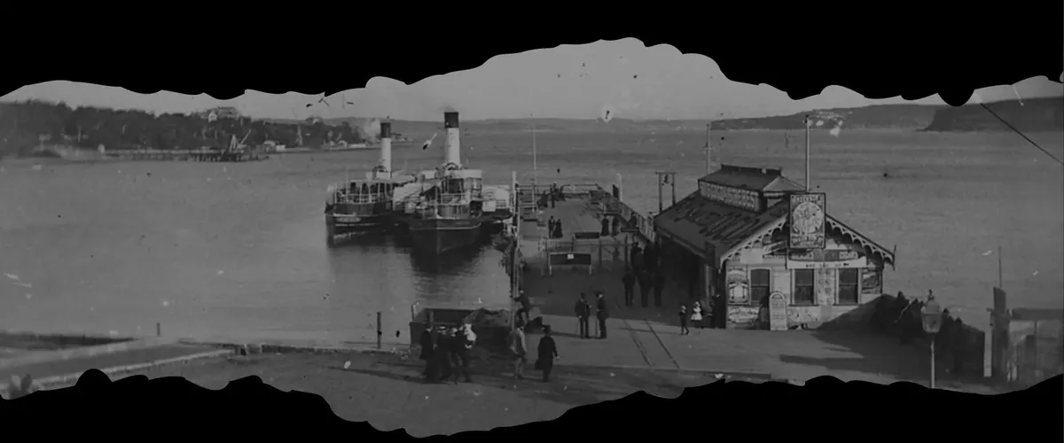 A historic black-and-white photograph of steamers at Manly Wharf, the setting of the Crooked Eight Packhunt